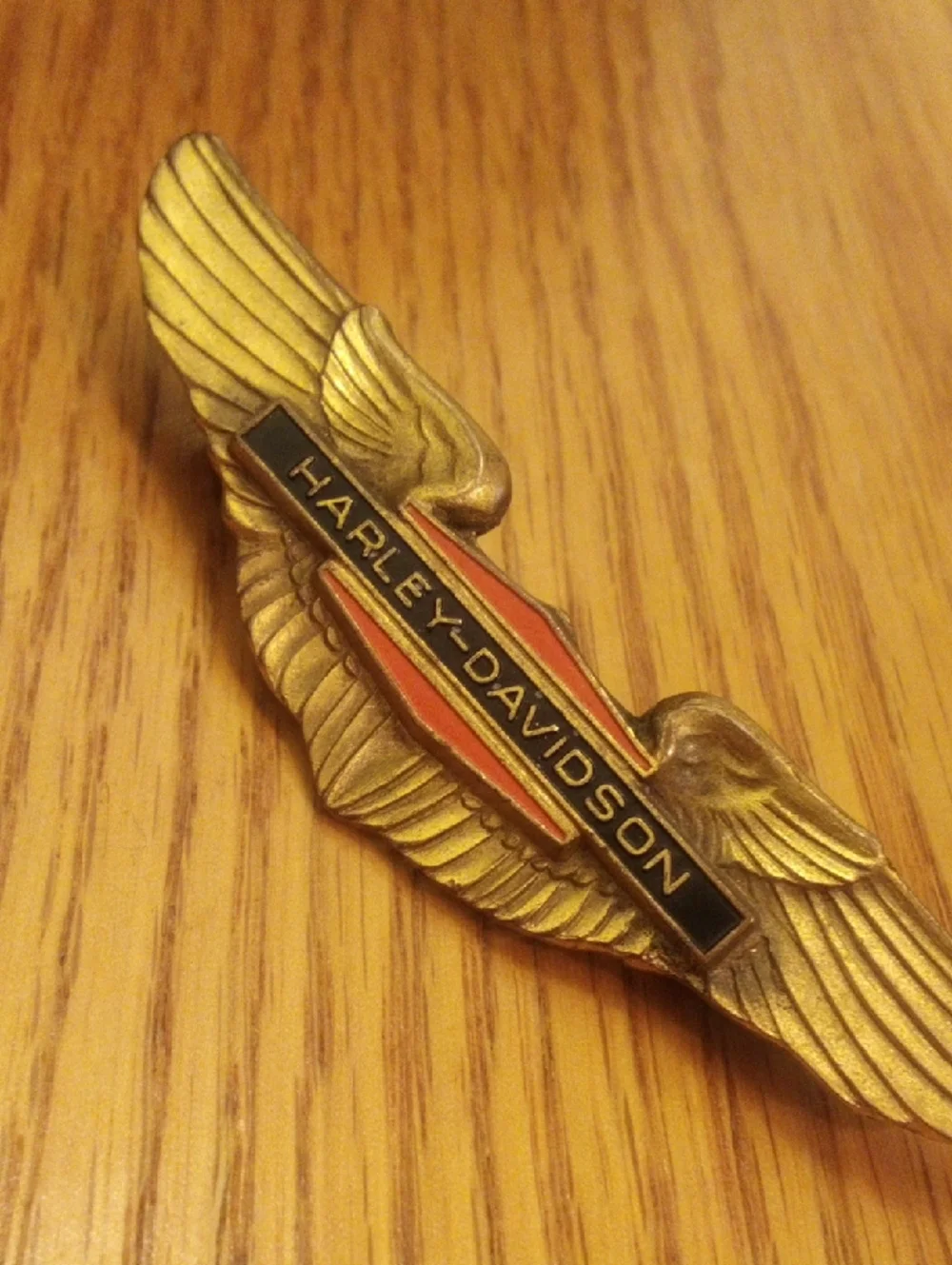Harley-Davidson Gold Winged Logo Pin with Black and Red Accents